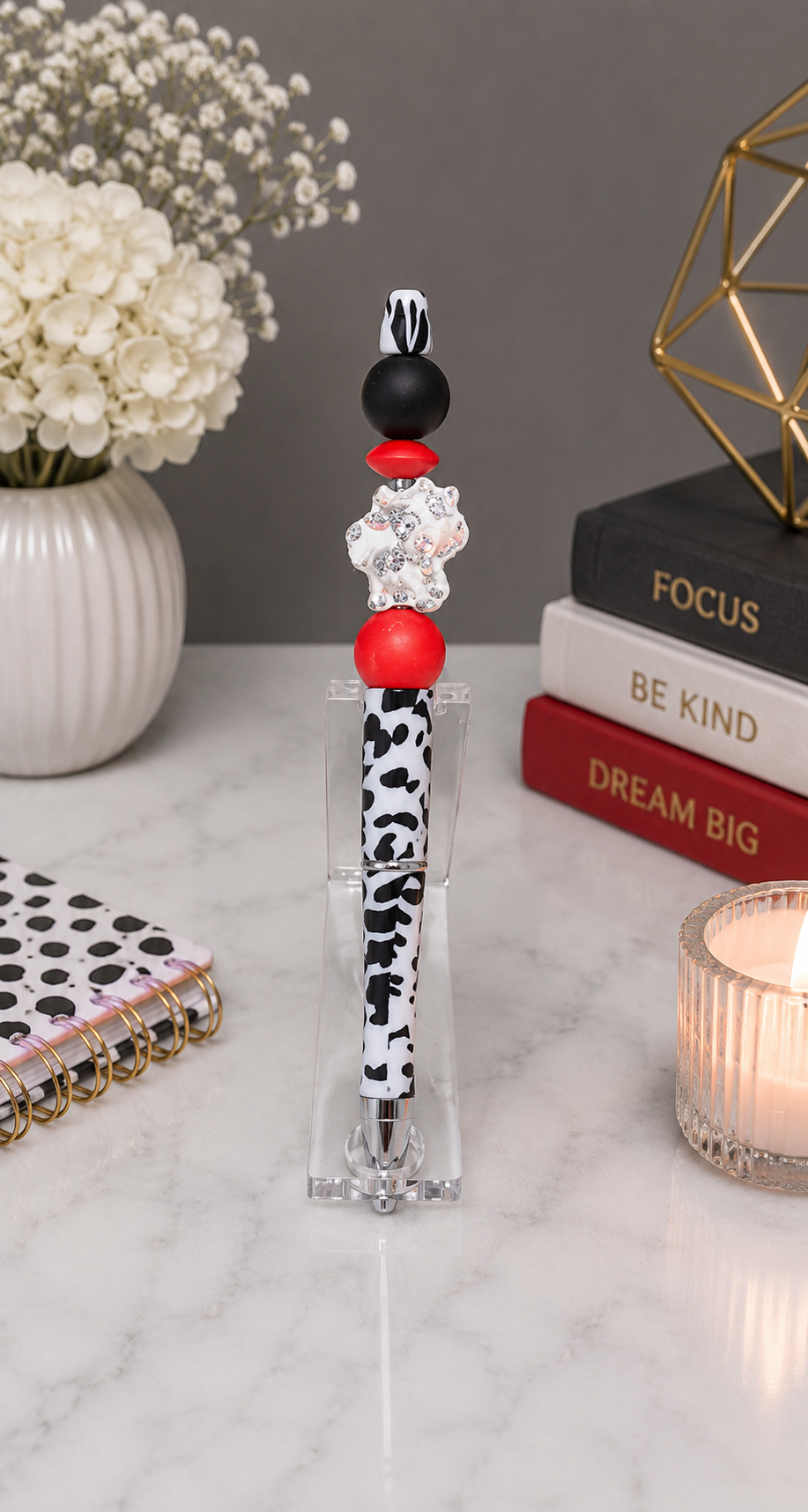 Cow print with red and black beads