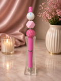 Pink ink pen with a variety of focal beads