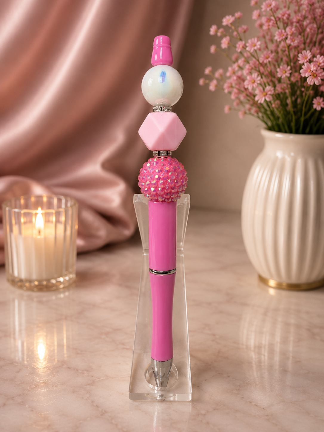 Pink ink pen with a variety of focal beads