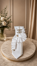 White tie with CC brooch and ruffles